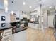 Modern kitchen with sleek black countertops, white cabinets, and stainless steel appliances at 16806 5Th Ne Ter, Bradenton, FL 34212