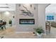 Modern linear fireplace features stone accent wall and open concept living space at 16806 5Th Ne Ter, Bradenton, FL 34212