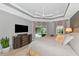 This main bedroom boasts an airy tray ceiling and private access to the lanai and pool at 16806 5Th Ne Ter, Bradenton, FL 34212
