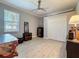 Well-lit office space with a large window, a ceiling fan, closet, and elegant tile floors at 16806 5Th Ne Ter, Bradenton, FL 34212