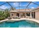 Inviting outdoor pool area with ample seating, lush landscaping, and a relaxing screened-in enclosure at 16806 5Th Ne Ter, Bradenton, FL 34212