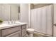 Bathroom featuring white vanity, toilet, and a shower with a white shower curtain at 204 Villoresi Blvd, Nokomis, FL 34275