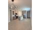 Modern kitchen with gray cabinets, stainless steel appliances, and an island with a granite countertop at 204 Villoresi Blvd, Nokomis, FL 34275