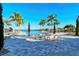An inviting pool area offering a relaxing setting and beautiful waterfront views for residents at 204 Villoresi Blvd, Nokomis, FL 34275