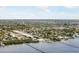 Waterfront aerial view of the community shows docks, water views, and tropical landscaping at 2107 Palma Sola Blvd # 27, Bradenton, FL 34209