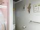 Bathroom featuring a shower with pink tiled walls, providing a comfortable and private space at 2107 Palma Sola Blvd # 27, Bradenton, FL 34209