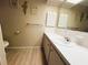 Neutral bathroom features a single sink, laminate flooring and standard size counter at 2107 Palma Sola Blvd # 27, Bradenton, FL 34209