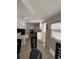 Open kitchen area with bright cabinetry, breakfast bar, and updated appliances at 2107 Palma Sola Blvd # 27, Bradenton, FL 34209