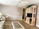 Bright living room features a ceiling fan, light wood floors, and neutral wall color at 2107 Palma Sola Blvd # 27, Bradenton, FL 34209