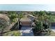 Charming single-story home with a well-manicured lawn, palm trees, and a brick driveway at 6739 Haverhill Ct, Lakewood Ranch, FL 34202