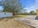 Enjoy privacy in this backyard with a storage shed, a concrete patio, and a wood fence at 1382 Ronald St, North Port, FL 34286