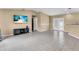 Spacious living room with gray tile flooring and neutral walls offers ample space at 1382 Ronald St, North Port, FL 34286