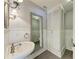 Charming bathroom with a vanity sink, decorative mirror, and built in shelving at 2299 Riverwood Ct, Sarasota, FL 34231