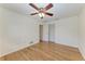 Bright bedroom with a ceiling fan, wood floors, and a large closet at 2299 Riverwood Ct, Sarasota, FL 34231