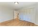 Bedroom featuring hardwood floors and a closet for storage at 2299 Riverwood Ct, Sarasota, FL 34231