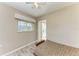 Bedroom featuring neutral walls, wood-look tile flooring, and natural lighting from a window at 2299 Riverwood Ct, Sarasota, FL 34231