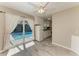 View of kitchen and dining area leading to screened patio with pool view at 2299 Riverwood Ct, Sarasota, FL 34231