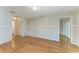 Open living room featuring hardwood floors and access to other areas of the home at 2299 Riverwood Ct, Sarasota, FL 34231