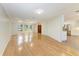 Open living space with hardwood floors, neutral walls, and abundant natural light at 2299 Riverwood Ct, Sarasota, FL 34231