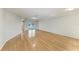 Spacious living room with gleaming hardwood floors and neutral paint color at 2299 Riverwood Ct, Sarasota, FL 34231