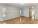 Bright living room with hardwood floors, neutral walls, and windows letting in natural light at 2299 Riverwood Ct, Sarasota, FL 34231