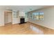 Living room boasts hardwood floors, a decorative fireplace, and built-in shelving at 2299 Riverwood Ct, Sarasota, FL 34231