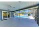 Covered patio and pool with screened enclosure at 2299 Riverwood Ct, Sarasota, FL 34231