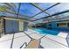 Pool with screen enclosure, outside shower, and a large deck at 2299 Riverwood Ct, Sarasota, FL 34231