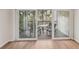 Balcony featuring outdoor seating with a view of lush greenery and landscaping at 2753 Orchid Oaks Dr # 104, Sarasota, FL 34239