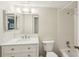 Bright bathroom featuring a shower-tub combination, vanity, and mirrored cabinet at 2753 Orchid Oaks Dr # 104, Sarasota, FL 34239