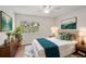 Bedroom featuring wood floors, window views, and stylish decor at 2753 Orchid Oaks Dr # 104, Sarasota, FL 34239