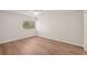 Bedroom featuring a ceiling fan and bright window with view of the yard at 2753 Orchid Oaks Dr # 104, Sarasota, FL 34239
