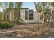 Multi-story building with private balconies surrounded by lush tropical landscaping at 2753 Orchid Oaks Dr # 104, Sarasota, FL 34239