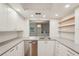 Bright kitchen with stainless steel appliances, light countertops, and ample storage space at 2753 Orchid Oaks Dr # 104, Sarasota, FL 34239