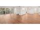 Open-concept living area with sliding glass doors leading to a private balcony at 2753 Orchid Oaks Dr # 104, Sarasota, FL 34239