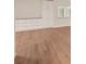 Detailed shot of hardwood floors and built-in storage solutions in living room at 2753 Orchid Oaks Dr # 104, Sarasota, FL 34239