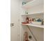 Walk-in pantry with white shelving for organized storage of household goods and supplies at 2753 Orchid Oaks Dr # 104, Sarasota, FL 34239
