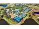 Aerial view of tennis and pickleball courts in golf course community, with easy access to a community pool at 3178 Dick Wilson Dr, Sarasota, FL 34240