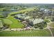 Beautiful aerial view of golf course community, showcasing lush green fairways, water features, and clubhouse at 3178 Dick Wilson Dr, Sarasota, FL 34240