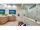 This bathroom offers a glass-enclosed shower, textured wall, and modern fixtures, creating a spa-like retreat at 3178 Dick Wilson Dr, Sarasota, FL 34240