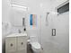 Clean bathroom featuring white fixtures, a glass-enclosed shower, and modern lighting for a refreshing and bright space at 3178 Dick Wilson Dr, Sarasota, FL 34240