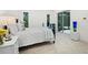 Cozy bedroom with a plush bed, elegant bedside table, and inviting atmosphere at 3178 Dick Wilson Dr, Sarasota, FL 34240
