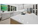 Bright kitchen with modern appliances, an island with a sink, and plenty of cabinet space at 3178 Dick Wilson Dr, Sarasota, FL 34240