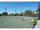 Outdoor tennis courts with lights and convenient ball carts invite enthusiasts for daytime or evening matches at 3178 Dick Wilson Dr, Sarasota, FL 34240