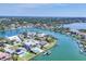 Aerial view capturing a waterfront community with lush landscaping, calm waterways, and private docks at 3638 San Remo Ter, Sarasota, FL 34239
