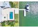 Overhead view of a luxury home featuring a pool, boat dock and lift on the waterfront at 3638 San Remo Ter, Sarasota, FL 34239