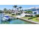 Stunning waterfront home with lush landscaping, a private dock and inviting pool area at 3638 San Remo Ter, Sarasota, FL 34239