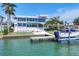 Stunning waterfront home with a private dock and modern architectural design featuring walls of glass and a pool at 3638 San Remo Ter, Sarasota, FL 34239