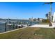 Beautiful waterfront property featuring a private dock with boat lift and views of the nearby bridge at 3638 San Remo Ter, Sarasota, FL 34239