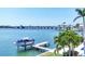 Picturesque waterfront scene featuring a private dock with boat lift and beautiful water views at 3638 San Remo Ter, Sarasota, FL 34239
